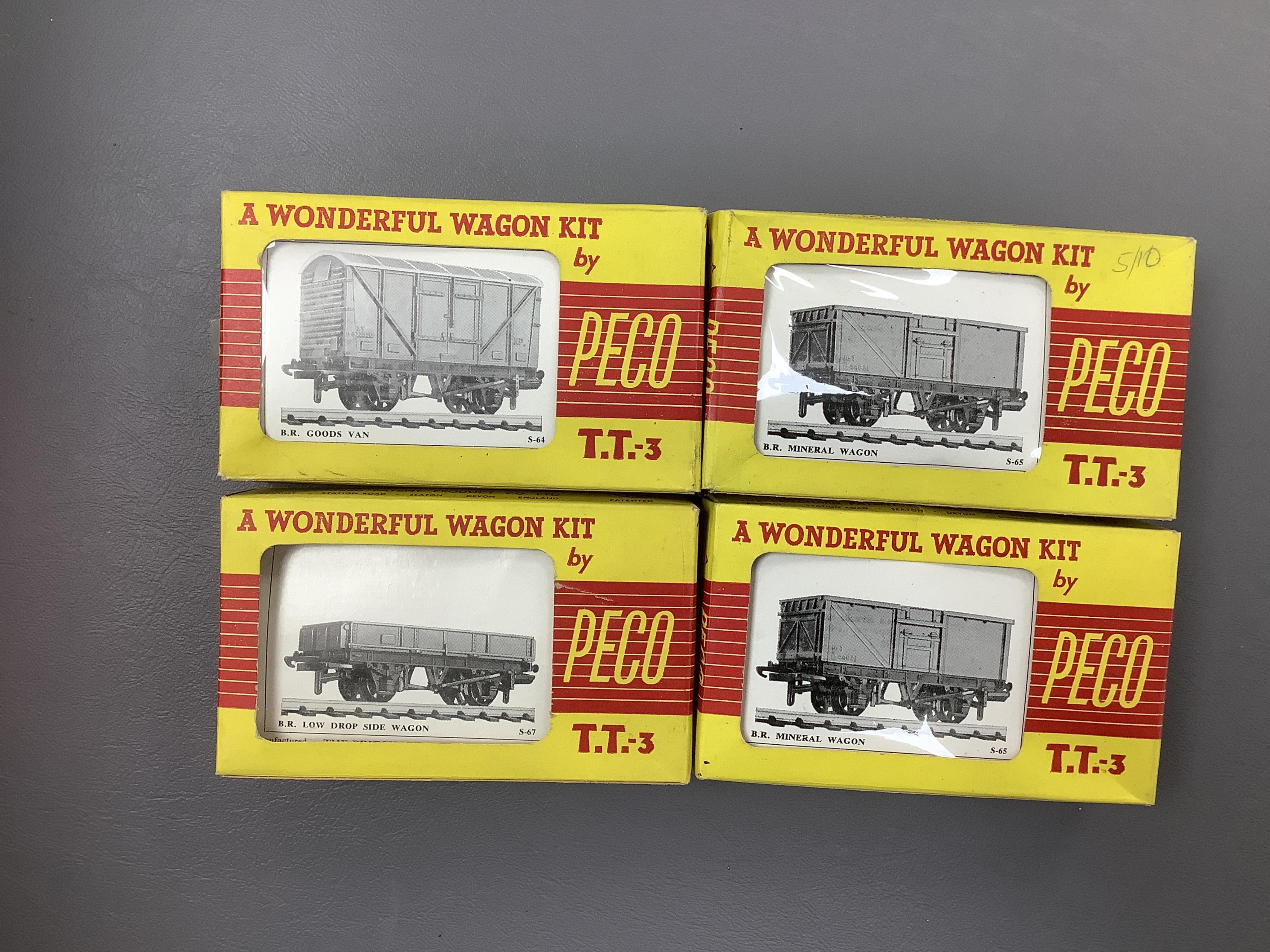 Fifteen items of TT gauge model railway by Peco, etc. including two white metal kit-built locomotives; a BR Prairie tank and a GWR 0-6-0T, together with 13 mainly kit built freight wagons, etc. Condition - fair, some rep